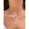 18K White Gold Tanzanite Drop Pendant With Diamond Halo