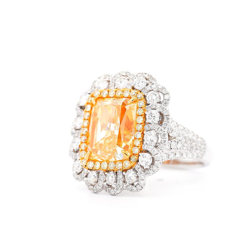 7 Carat Fancy Intense Yellow Radiant Cut Diamond and Diamond Halo Ring | GIA Certified