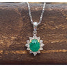 Cabochon Cut Emerald and Diamond pendant in 18k white gold floral/star design