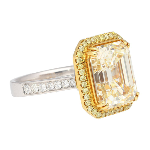 Emerald Cut Natural 7.25 Carat Fancy Light Yellow Diamond with Round Diamond Halo Ring