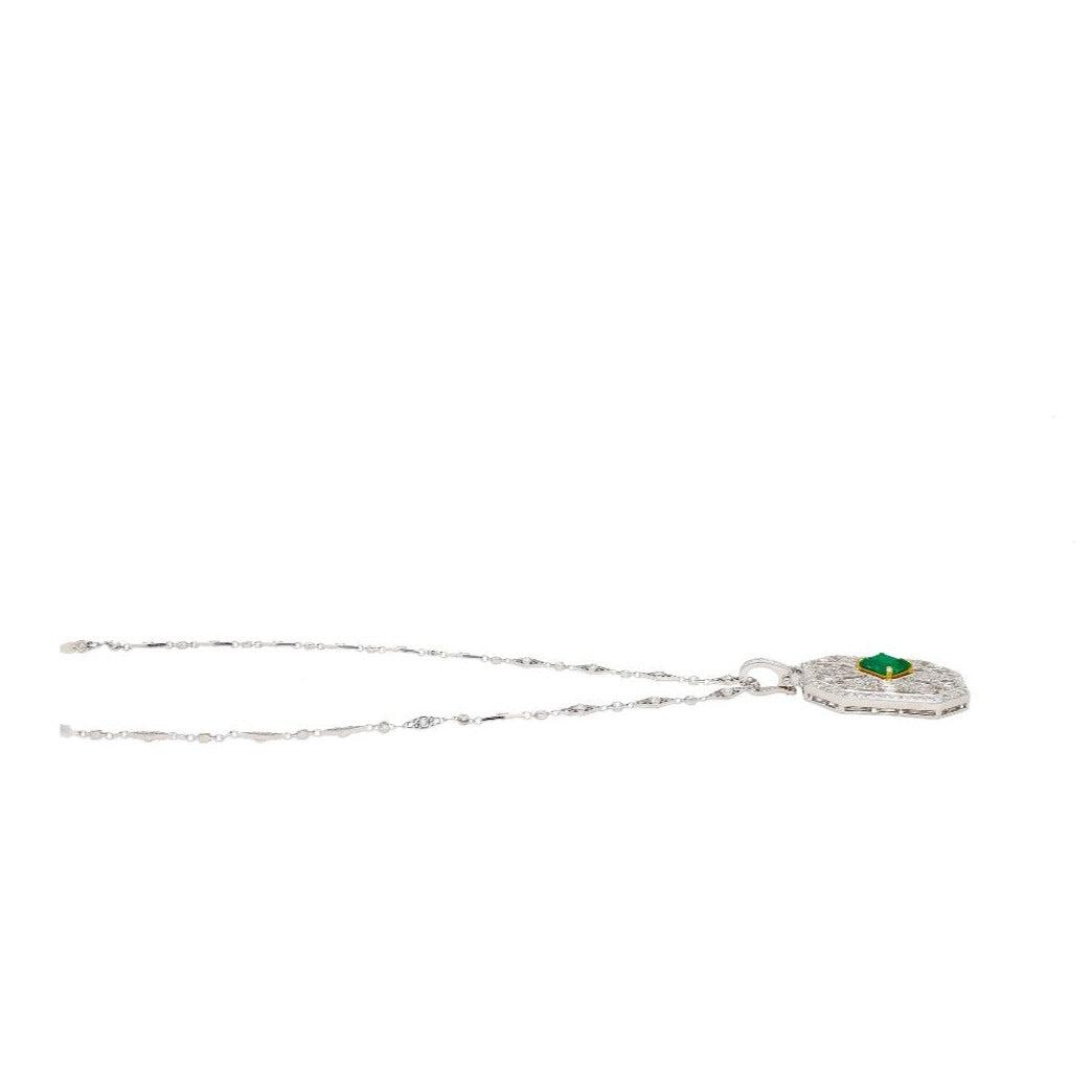 Vintage Carved Platinum 3.16 Carat Vivid Green Minor Oil Emerald Pendant with 4 CTTW in Diamonds