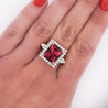 Vivid Pink 7 Carat Radiant Cut Tourmaline Ring with Round Diamond Halo in 18K Gold